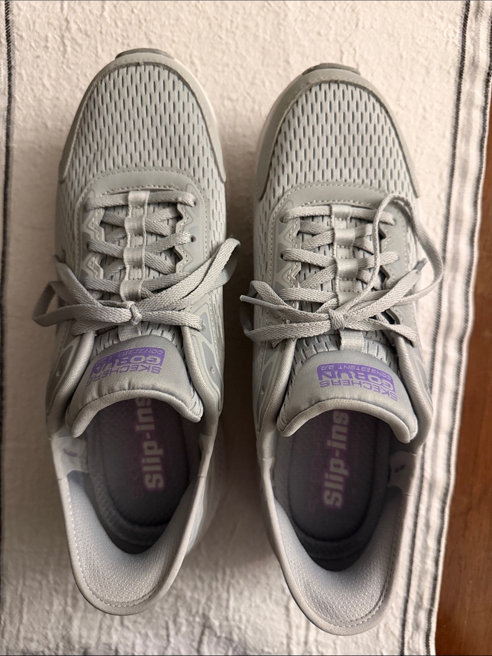 Skechers Women's Light Gray Slip-On Athletic Sneakers with Purple Accents